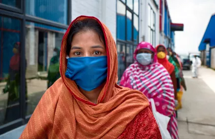 Aklima, 28, an unemployed domestic worker in Dhaka, waits in line for food aid distributed by Oxfam partner Nari Maitree in July. “We have had no work since the lockdown. It’s been three months. We are struggling to find a way to make a living. Everyo