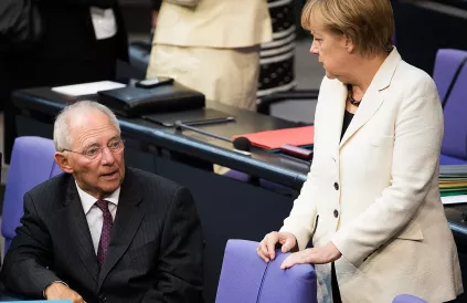 Wolfgang Schaüble naast Angela Merkel (2014). Foto: Tobias Koch/CC BY-SA 3:0
